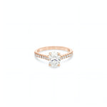 18ct rose and white gold diamond ring featuring a 1.02ct E/SI2 oval cut diamond in a white gold four-claw setting with diamond-set shoulders.