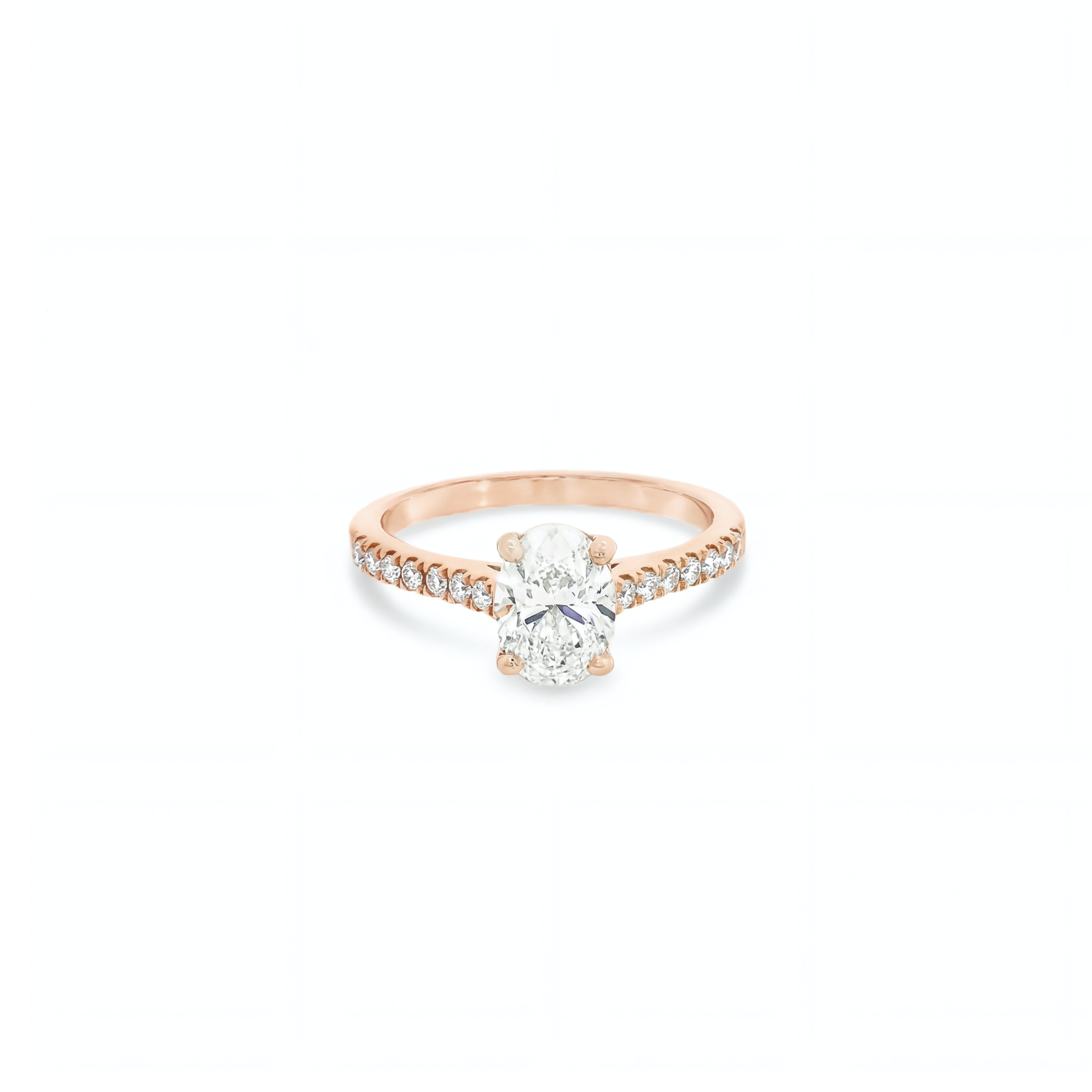 18ct rose and white gold diamond ring featuring a 1.02ct E/SI2 oval cut diamond in a white gold four-claw setting with diamond-set shoulders.