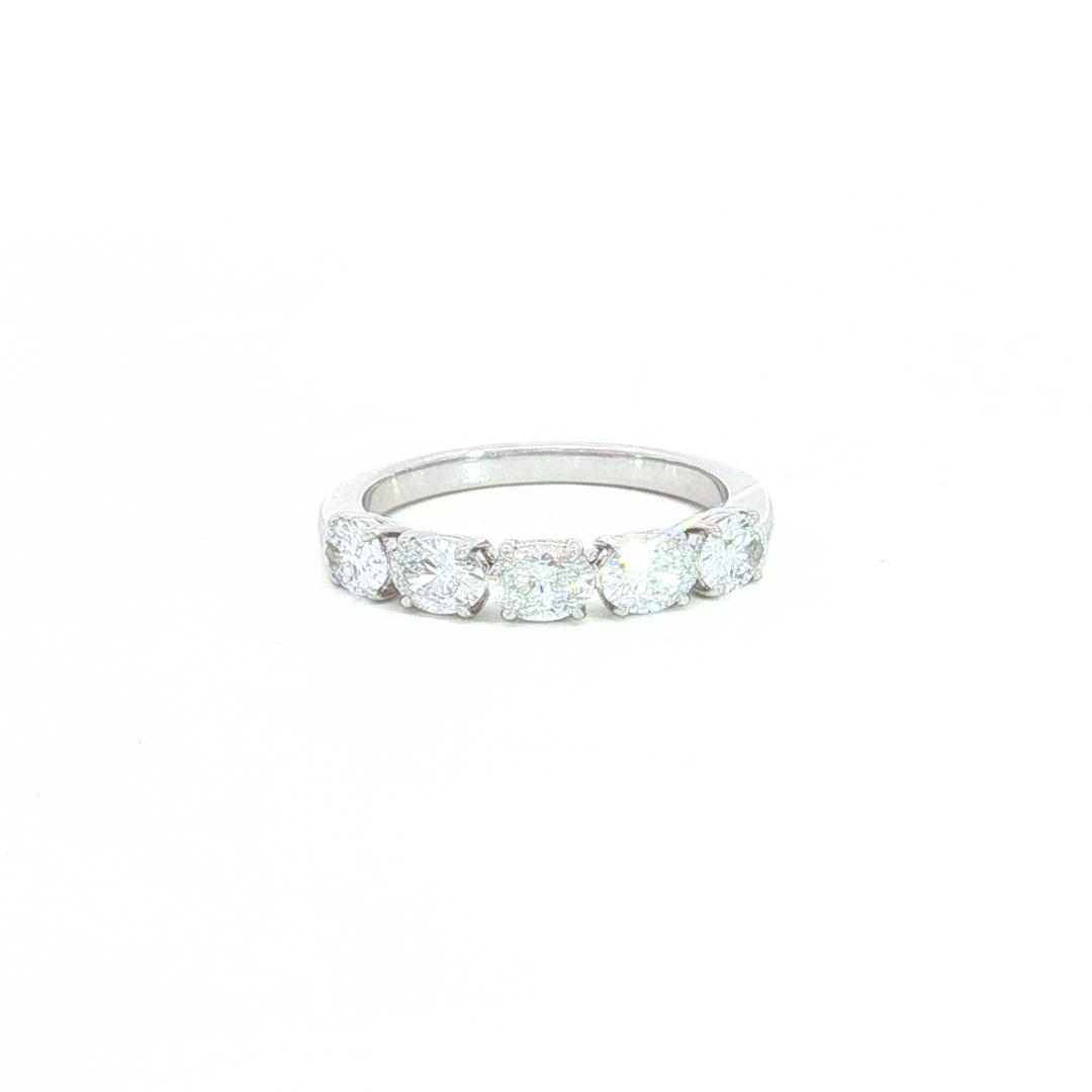 18ct white gold diamond ring featuring five oval-cut diamonds in classic four-claw settings.