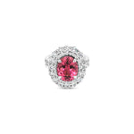 18ct white gold ring featuring a 3.66ct oval cut pink tourmaline surrounded by double diamond halos with diamond-set shoulders.