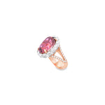 18ct rose and white gold ring featuring a 9.25ct oval pink tourmaline surrounded by a halo of diamonds, with rubies bead set into the undercarriage and split claw shoulders.