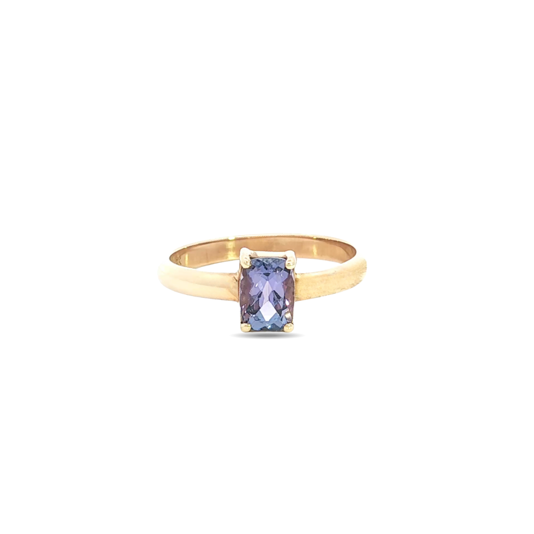 9ct yellow gold ring featuring a 9x5mm oval cut tanzanite in a four-claw setting with post and bezel collet.