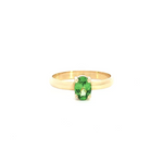 18ct yellow gold ring featuring a 7x5mm oval cut tsavorite in a four-claw setting with post and bearing collet.