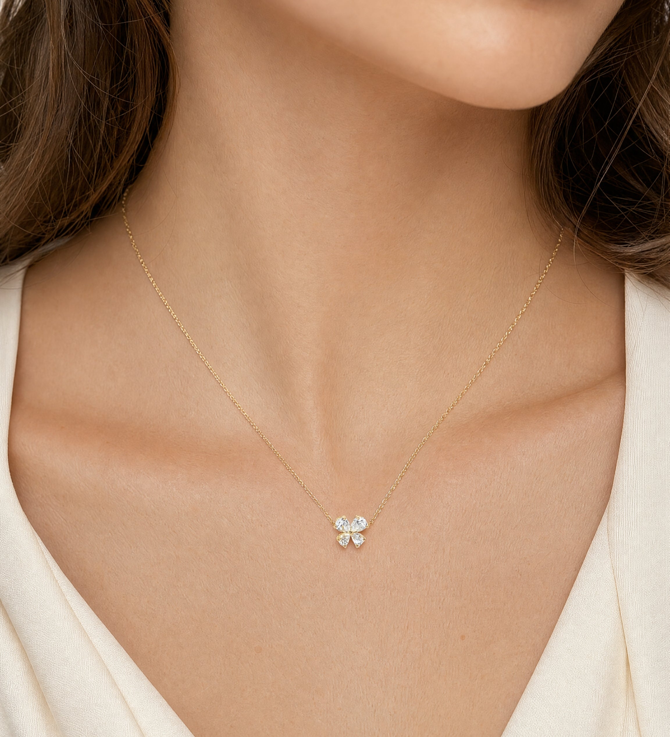 18ct yellow gold diamond necklace with pear cut diamonds arranged in offset clover cluster