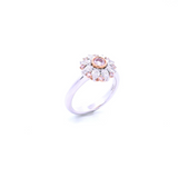 18ct white and rose gold floral ring featuring a central pink diamond, alternating pink and white diamonds, and a finely detailed cut-out back.