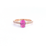 18ct rose and white gold ring featuring a 0.90ct oval cut pink spinel with diamond-set shoulders.