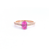 18ct rose and white gold ring featuring a 0.90ct oval cut pink spinel with diamond-set shoulders.