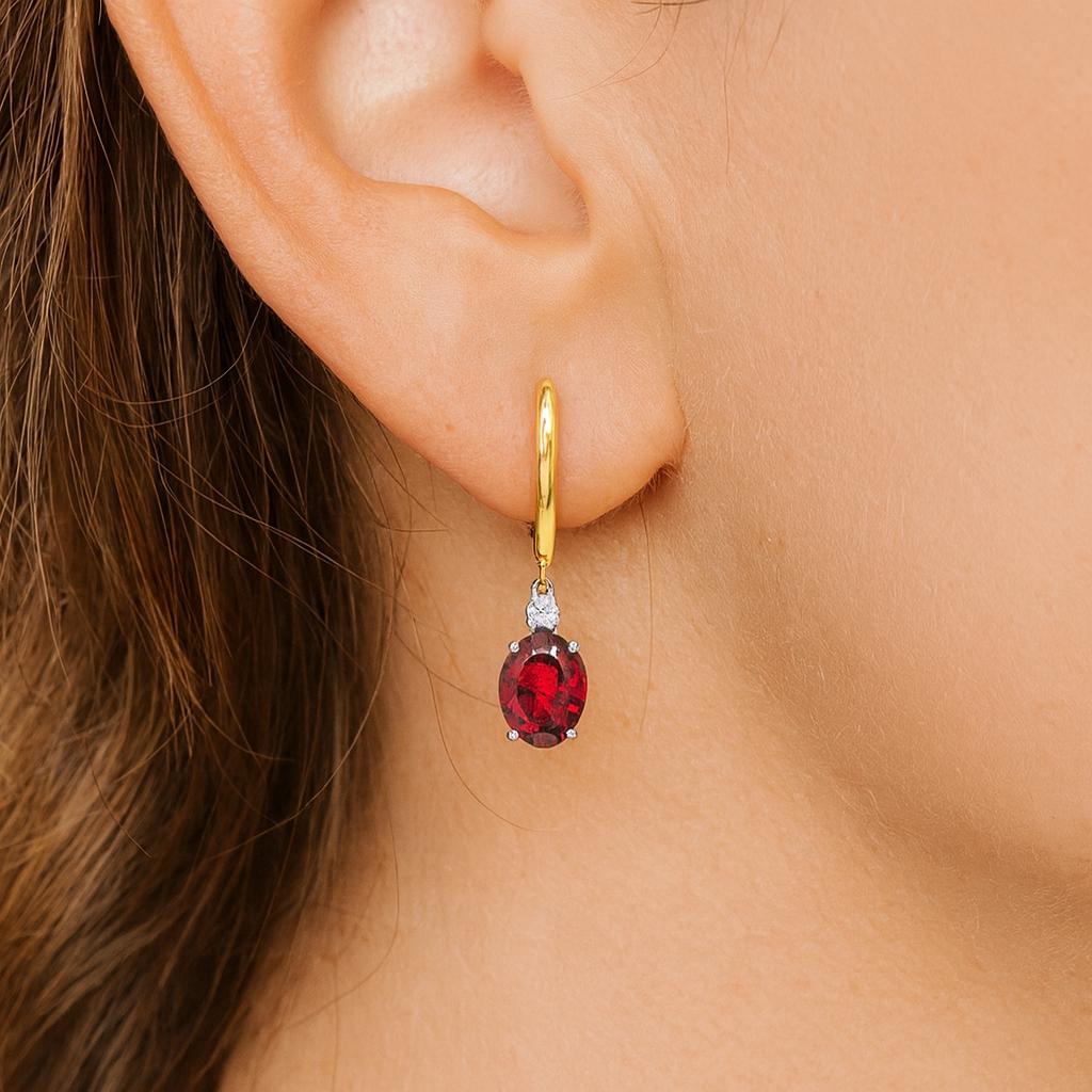 18ct yellow and white gold earrings featuring 8x6mm pink tourmalines and diamond accents in articulated double drop design with hinged huggie tops.