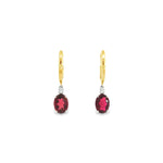 18ct yellow and white gold earrings featuring 8x6mm pink tourmalines and diamond accents in articulated double drop design with hinged huggie tops.