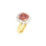 18ct yellow gold ring featuring a 4.50ct cushion-cut pink tourmaline surrounded by 1.48ct round brilliant cut diamonds in a white gold setting.