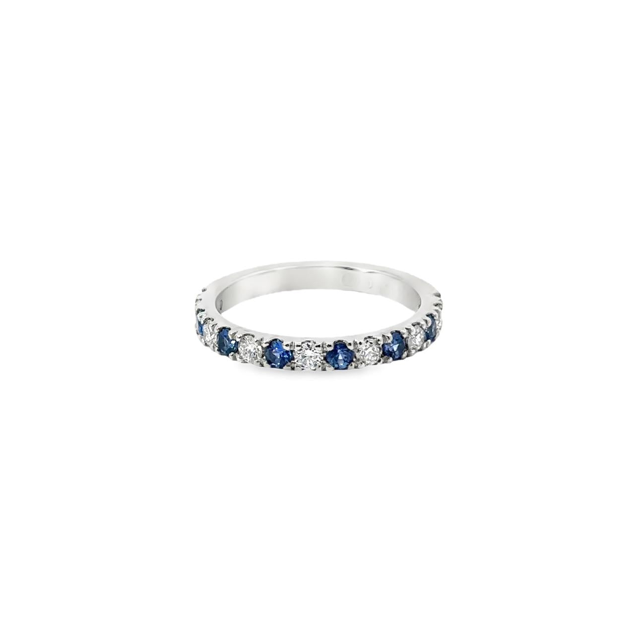 Platinum band with alternating claw-set blue sapphires and diamonds.