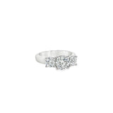 Platinum three-stone diamond ring with tiered round brilliant cut settings.