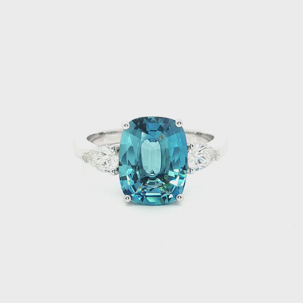 18ct white gold aquamarine ring with pear cut diamond side stones