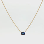 18ct yellow gold necklace with emerald cut sapphire set horizontally in bezel