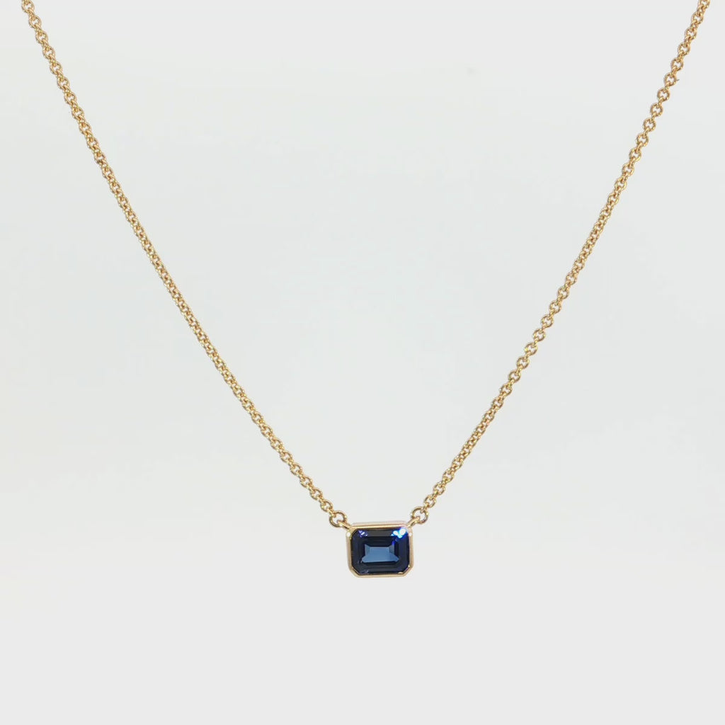 18ct yellow gold necklace with emerald cut sapphire set horizontally in bezel