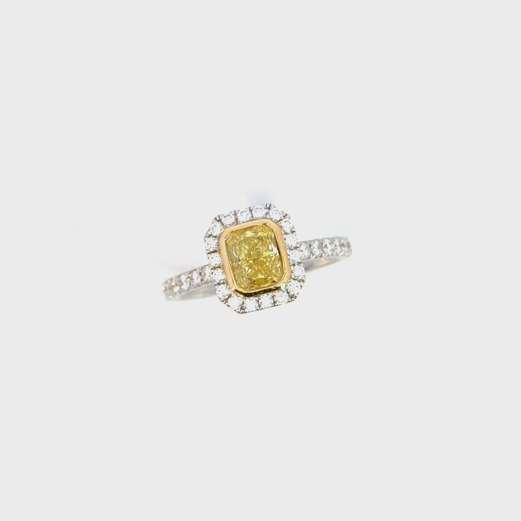 Two-tone 18ct yellow and white gold diamond ring with a 1.01ct Fancy Intense Yellow centre diamond and diamond cluster surround.