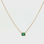 18ct yellow gold necklace with emerald cut emerald set horizontally in bezel
