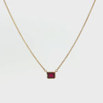 18ct yellow gold necklace with emerald cut ruby set horizontally in bezel