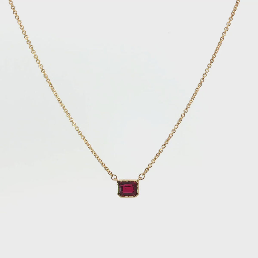 18ct yellow gold necklace with emerald cut ruby set horizontally in bezel