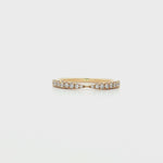 Tapered diamond band in yellow gold