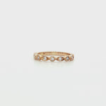 9ct yellow gold diamond ring featuring nine round brilliant cut diamonds totalling 0.20ct in alternating hexagonal and marquise bead settings.
