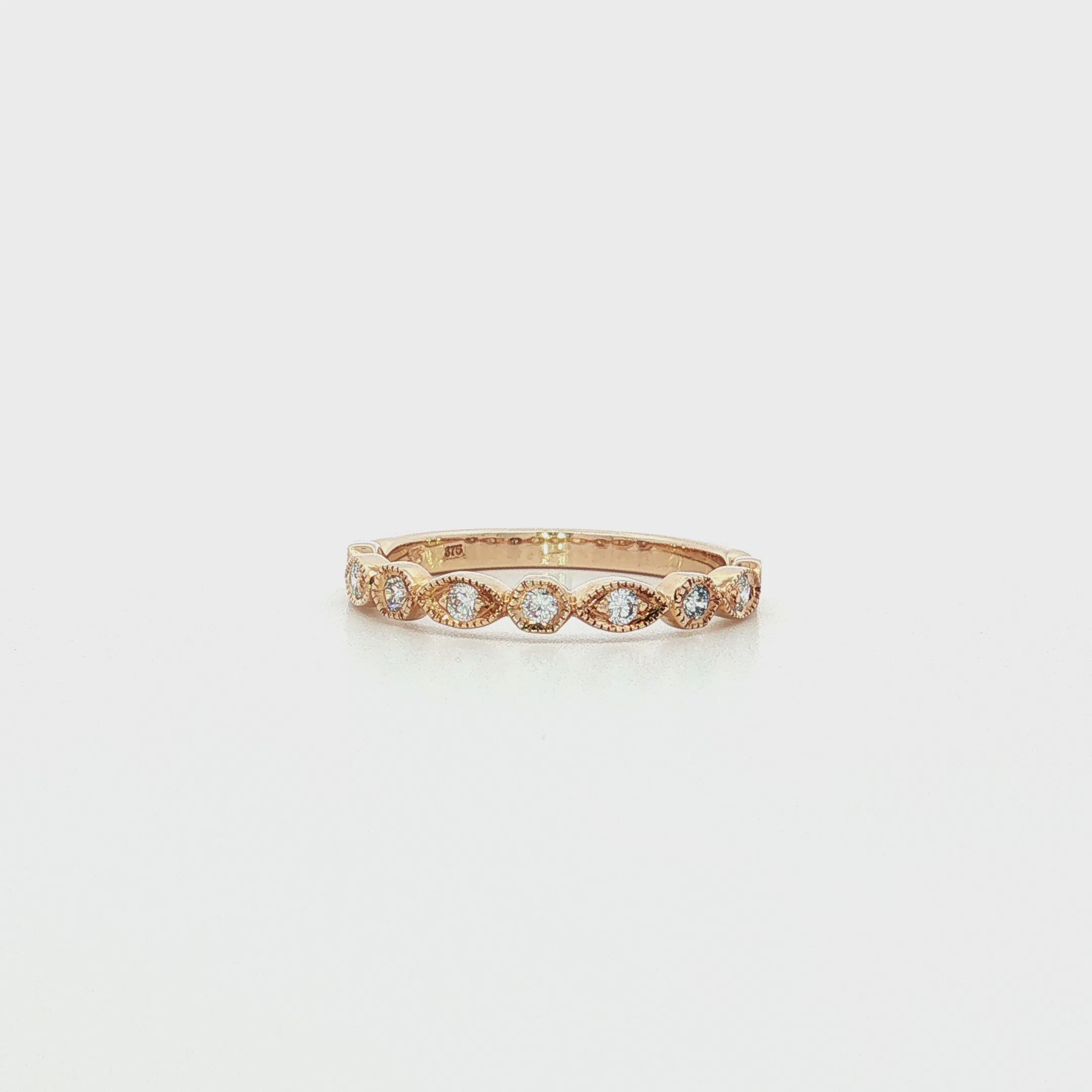 9ct yellow gold diamond ring featuring nine round brilliant cut diamonds totalling 0.20ct in alternating hexagonal and marquise bead settings.