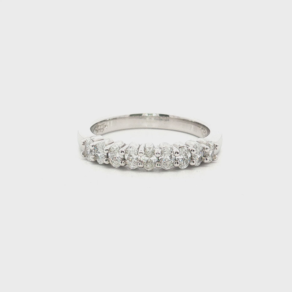 platinum diamond band ring with oval cut diamonds in shared claw setting
