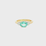 9ct yellow and white gold ring with 1.17ct horizontal oval green beryl and triangular diamond accents.