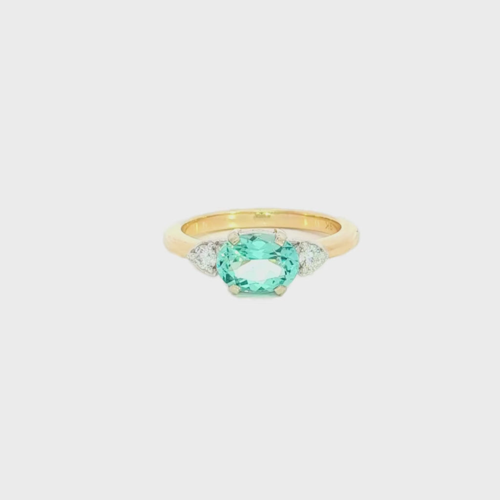 9ct yellow and white gold ring with 1.17ct horizontal oval green beryl and triangular diamond accents.