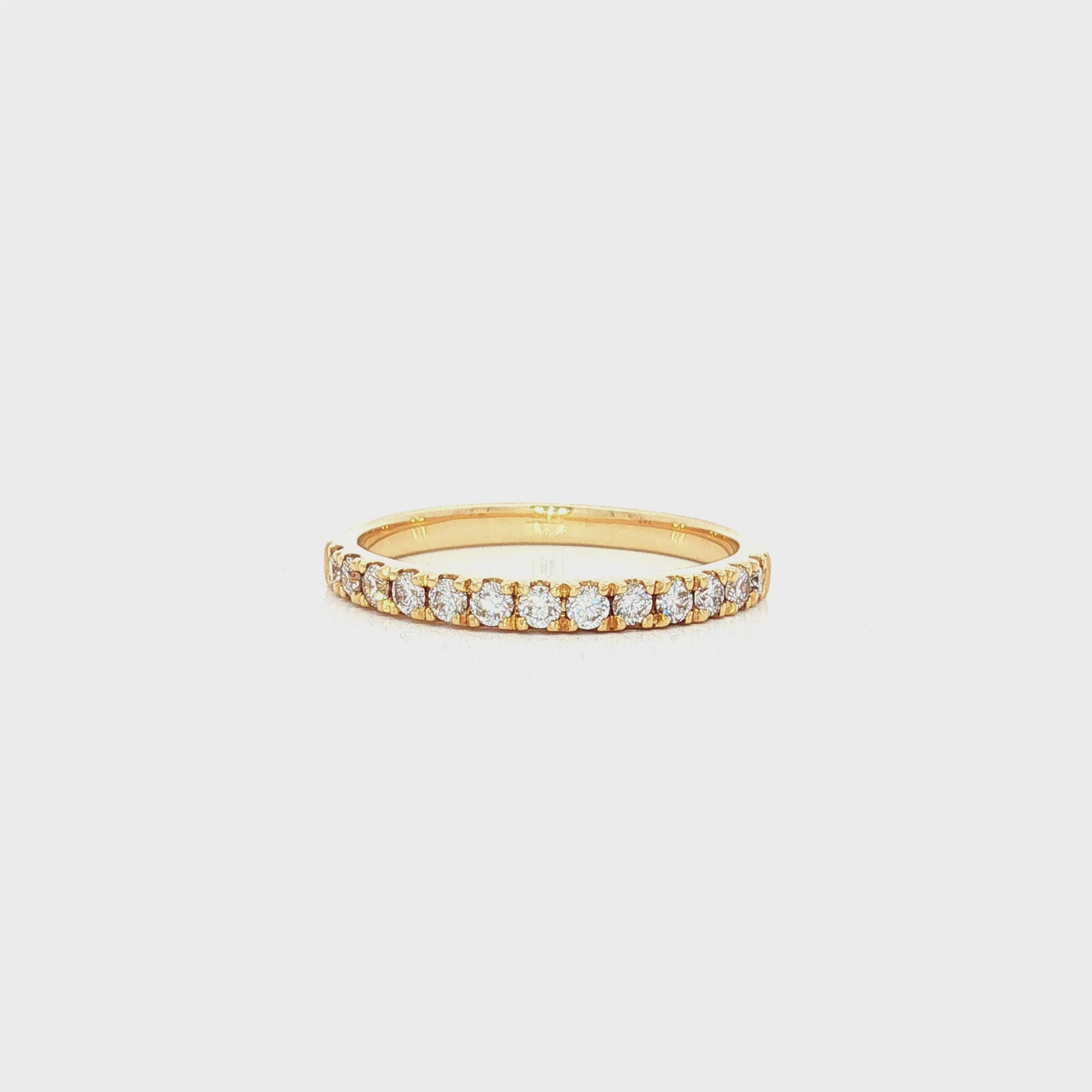 Diamond band in yellow gold with round brilliant cut diamonds