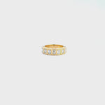 18ct yellow gold diamond ring featuring seven emerald cut diamonds in a straight row bezel setting across the top.
