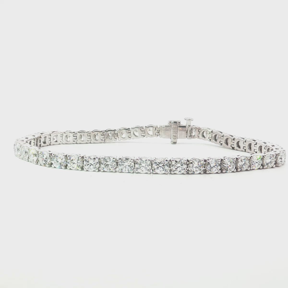 18ct white gold diamond tennis bracelet with large round brilliant cut diamonds in four claw settings