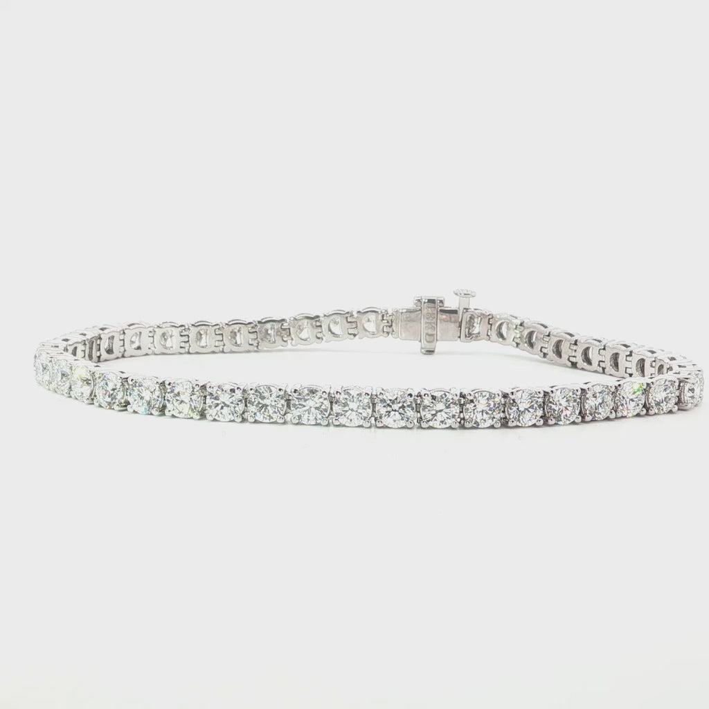 18ct white gold diamond tennis bracelet with large round brilliant cut diamonds in four claw settings