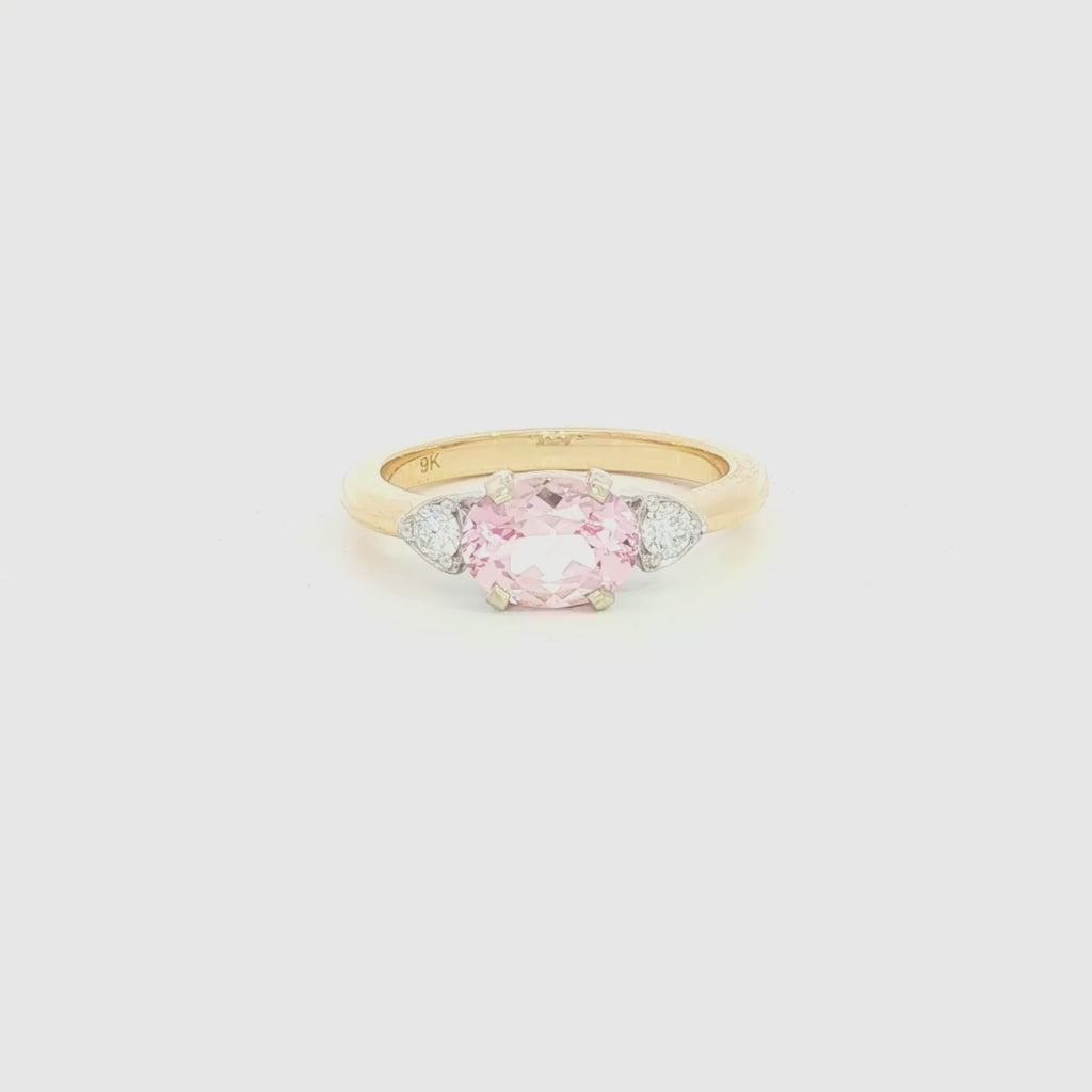 9ct yellow and white gold ring with horizontal oval morganite and diamond side accents.