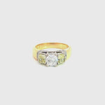 18ct yellow and white gold diamond ring featuring a 0.91ct cushion cut centre diamond with Fancy Yellow side diamonds and round diamond accents.