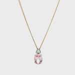 9ct white gold oval morganite and diamond pendant with triangular diamond detail.