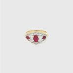 18ct yellow and white gold five-stone ruby and diamond ring featuring alternating claw-set gems with a pointed diamond surround.