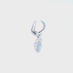 18ct white gold aquamarine and diamond drop earrings featuring cushion cut aquamarines with diamond halos and huggie-style fittings.