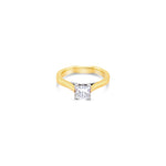 Two-tone yellow and white gold princess cut diamond ring with a crossover collet and curved shank.