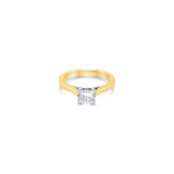 Two-tone yellow and white gold princess cut diamond ring with a crossover collet and curved shank.