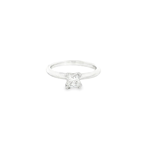 Platinum diamond ring featuring a 0.71ct F/SI1 princess cut diamond in a four-claw setting on a knife-edge band.