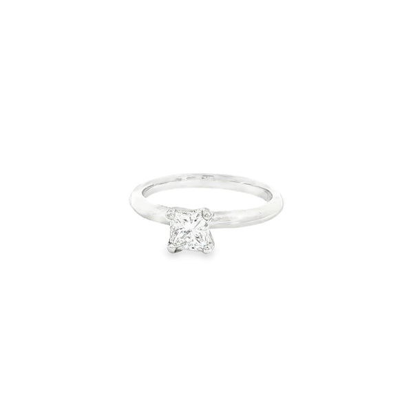 Platinum diamond ring featuring a 0.71ct F/SI1 princess cut diamond in a four-claw setting on a knife-edge band.