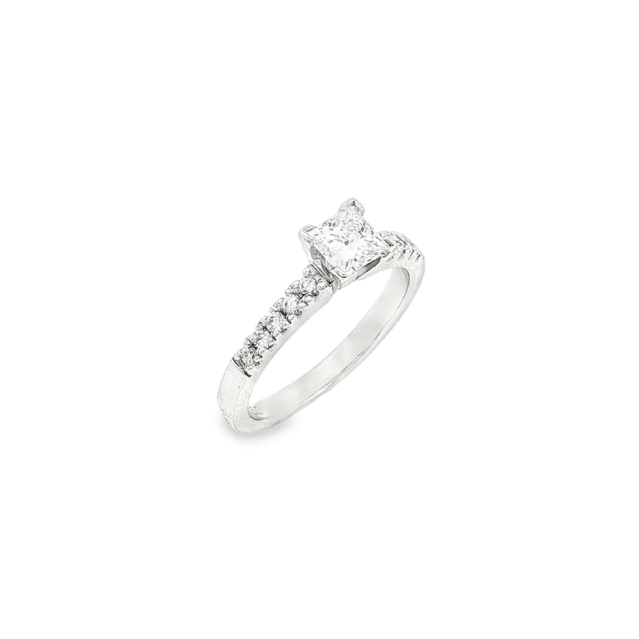 18ct white gold diamond ring featuring a 0.51ct princess cut diamond with ten round brilliant cut diamond accents.