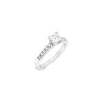 18ct white gold diamond ring featuring a 0.51ct princess cut diamond with ten round brilliant cut diamond accents.