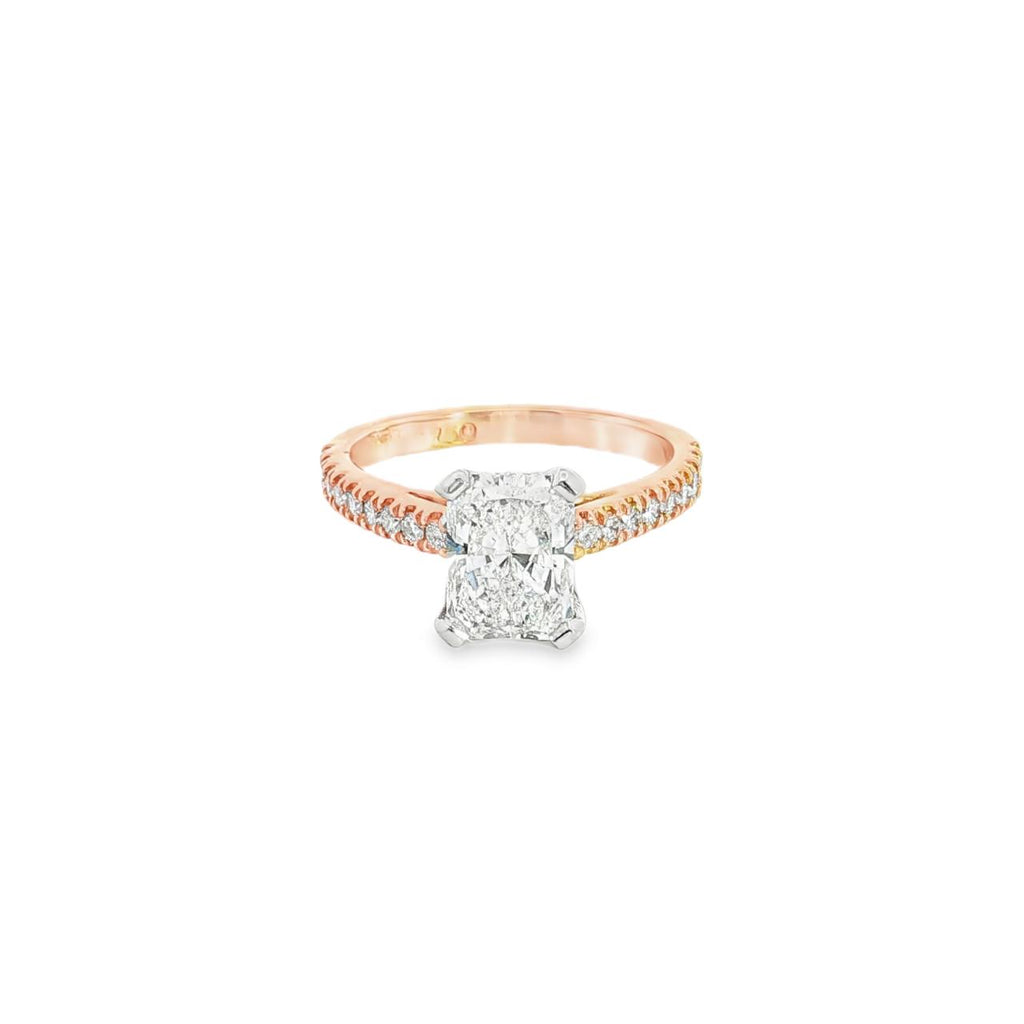 18ct rose gold and platinum diamond ring featuring a 1.50ct radiant cut centre diamond and diamond-set shoulders.