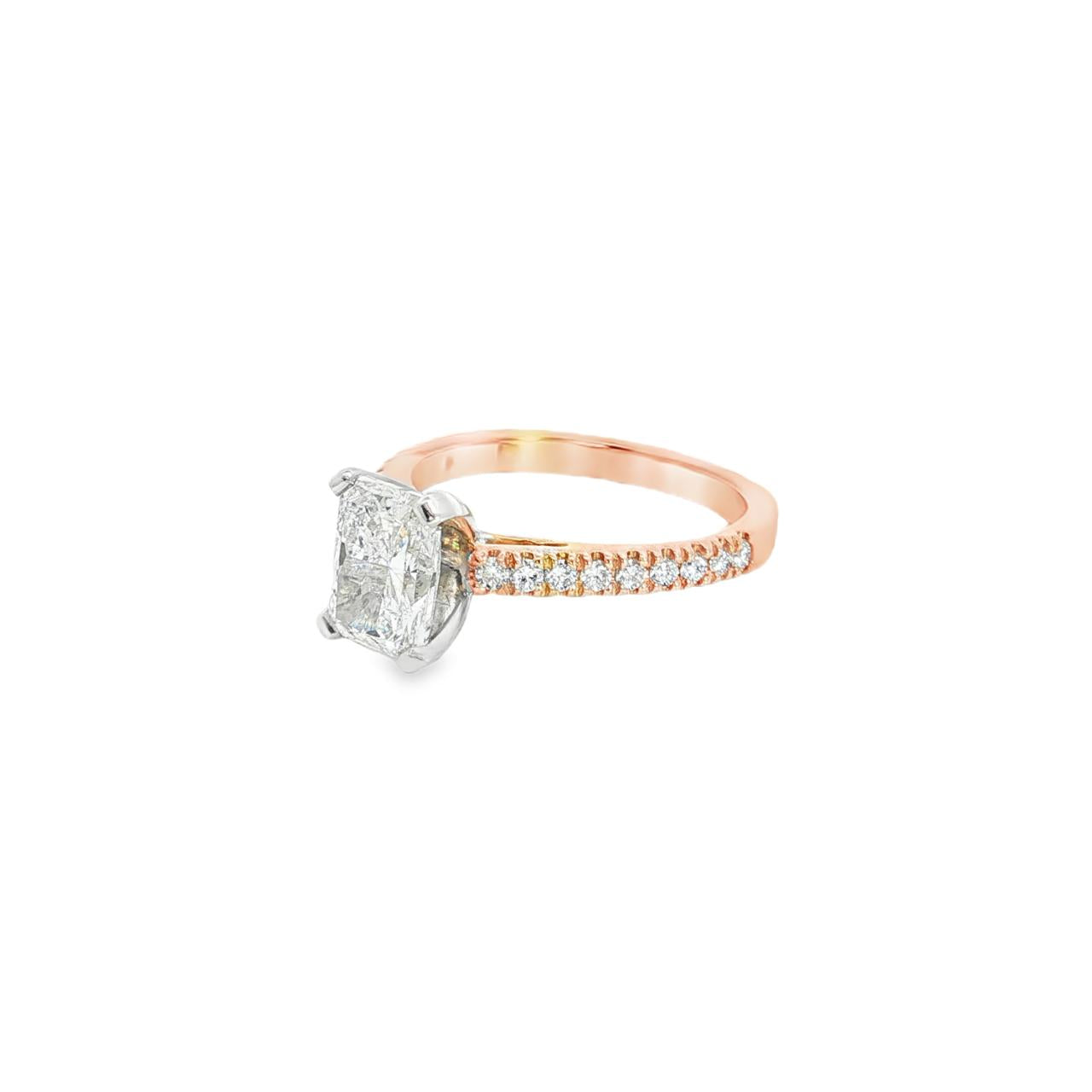 18ct rose gold and platinum diamond ring featuring a 1.50ct radiant cut centre diamond and diamond-set shoulders.
