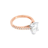 18ct rose gold and platinum diamond ring featuring a 1.50ct radiant cut centre diamond and diamond-set shoulders.