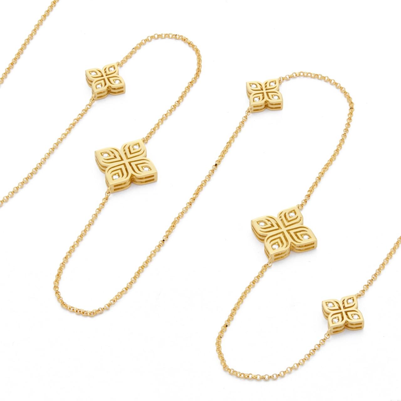 Roberto Coin Arabesque Flower 18ct yellow gold 85cm necklet featuring diamond-set flower motifs spaced along the chain and signature ruby clasp.