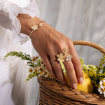 Roberto Coin Jasmine 18ct yellow gold diamond bangle with double flower design and rope detailing