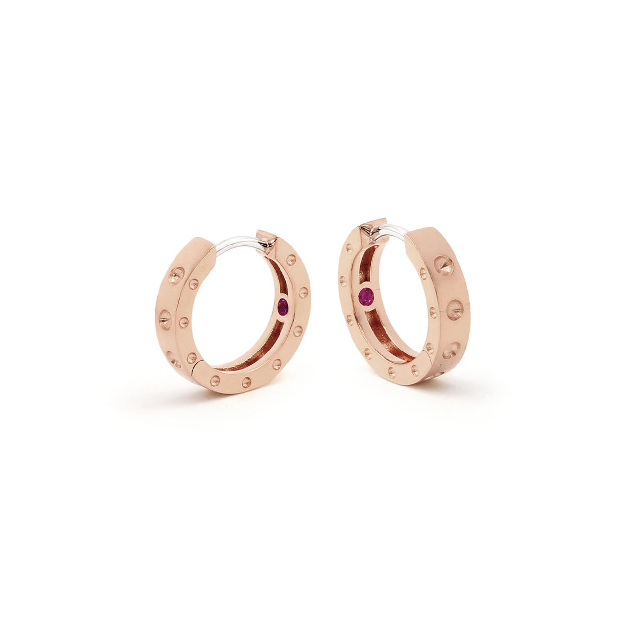 Roberto Coin Pois Moi 18ct rose gold diamond huggie earrings with polished dimple design and hidden rubies.